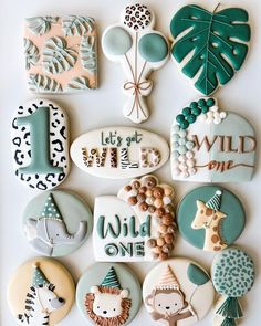 decorated cookies are arranged in the shape of animals