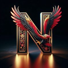 the letter n is decorated with red and black feathers, gold trimmings, and ornate designs