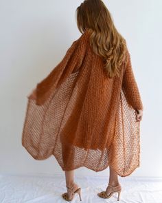 Hello, I'm the one, who won't let you down - burnt orange mohair cardigan. I will comfort you, keep you warm and will make you smile. I'm 100% hand made and proud of that. I consist of 70% italian kid mohair and 30% of nylon, which makes me incredibly natural. I'm quite unique as could be worn all year long. I'm embroidered with thin yarn of gold lurex, which makes me really chic. I'm in one size and one size fits all because my measurements are : ❤️ Width -54 cm ❤️ Lengths -125 cm If you would Long Kimono Cardigan, Light Cardigan, Loose Knit Sweaters, Mohair Cardigan, Stylish Sweaters, Long Kimono, Cardigan Long, Wrap Cardigan, Oversized Cardigan