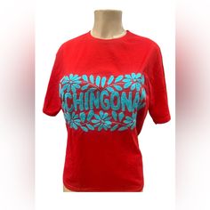 Show Off Your True Mexicana In Our Red Embroidered Chingona T-Shirt! Crafted By Mexican Artisans From Chiapas With 100% Cotton Fabric And Beautiful Handmade Embroidery, It's The Perfect Way To Feel Cool And Look Hot. Muy Chingona! Red Embroidered Short Sleeve T-shirt, Red Embroidered Crew Neck T-shirt, Red Crew Neck Top With Embroidered Text, Red Embroidered Graphic Tee, Red Embroidered Graphic Tee T-shirt, Red Relaxed Fit Top With Embroidered Graphics, Casual Red T-shirt With Embroidered Graphics, Red Short Sleeve T-shirt With Embroidered Text, Red Cotton Tops With Embroidered Graphics