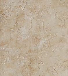 a wall that has some kind of textured surface on it, and is beige