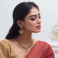 About the Jewelry Stand out from the crowd with this elegant antique necklace set. This floral intricate antique necklace is a dreamy affair for every woman. Made with high-quality Kempu stone, this Gutta Pusalu inspired necklace set is great for the woman who loves the fusion of Indian cultural heritage and fashion trends. Styling Tip Match it with a beautiful traditional golden embellished silk saree on your special day. Details & Specifications: Materials used: Kempu Stone with Antique Platin Radha Raman, Indian Necklace Set, Antique Necklace Set, Gutta Pusalu, Jhumka Designs, Necklace Set Indian, Gold Jewelry Simple Necklace, Heritage Jewellery, Celebrity Jewelry