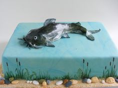 a cake decorated with an image of a fish