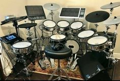 an electronic drum set up on top of a rug