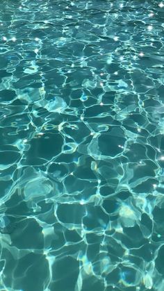 the water is very clear and blue with little ripples on it's surface