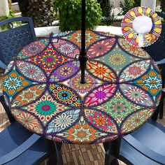 an outdoor table and chairs are decorated with colorful designs