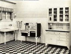 an old fashioned kitchen with black and white checkered flooring