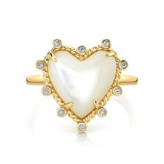 Add a touch of romance to your stack with the Diamond and Mother of Pearl Heart Twist Ring. The Mother of Pearl heart shaped stone is framed with a delicate rope border and bezel set white diamond accents on a slim gold band. This ring looks great on it's own or paired with your other favorites. Luxury White Heart Ring, Luxury White Heart Ring With Diamond Accents, Elegant Heart Ring With Bezel Setting For Valentine's Day, Elegant Heart Ring With Bezel Setting For Wedding, White Heart Ring With Diamond Accents, Rope Border, Mother Of Pearl Ring, Carved Heart, Heart Stone