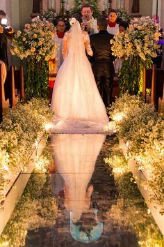 the bride and groom are walking down the aisle