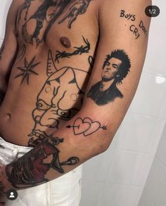 a man with tattoos on his arm and chest