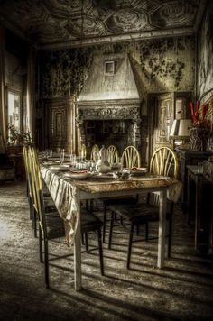 an old fashioned dining room with table and chairs