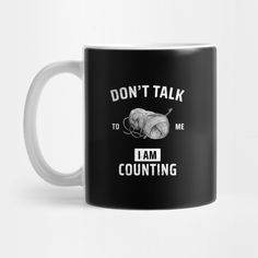 a black and white coffee mug that says don't talk to me i am counting