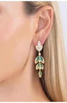 Clear cubic zirconia stones frame green marquis crystals to create these leaf inspired dangle earrings. Post back Brass/cubic zirconia Imported Elegant Green Leaf-shaped Earrings, Elegant Green Leaf-shaped Jewelry, Elegant Green Marquise Earrings, Earrings In Gold, Statement Earrings, Eye Candy, Cubic Zirconia, Dangle Earrings, Angeles