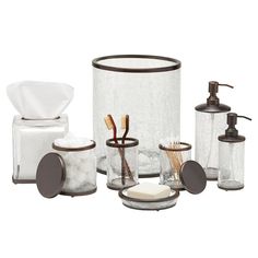 bathroom accessories including soap dispenser and toothbrush holder