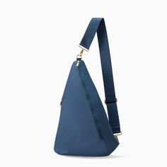 a blue sling bag on a white background