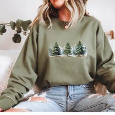 Embrace the winter wonderland with this cozy Snowy Pine trees sweatshirt. Perfect for camping trips or just staying warm during the colder months. This sweatshirt exudes a tranquil and peaceful atmosphere, making it ideal for nature lovers and winter enthusiasts. It's a great gift for Christmas, winter holidays, or any occasion celebrating the beauty of the snowy season. Product features - Knit in one piece without side seams for reduced fabric waste - Ribbed knit collar with seam for elasticity and shape retention - Medium-heavy fabric blend of 50% cotton and 50% polyester for coziness - Classic fit and crew neckline for a comfy wearing experience - Double-needle stitching for top-tier durability Care instructions - Machine wash: cold (max 30C or 90F) - Non-chlorine: bleach as needed - Tu Outdoor Cotton Sweater For Winter, Long Sleeve Winter Sweatshirt For Outdoor Activities, Winter Outdoor Crew Neck Hoodie, Winter Crew Neck Hoodie For Outdoor, Cozy Winter Sweatshirt For Outdoor Activities, Casual Winter Sweatshirt For Outdoor Activities, Casual Sweatshirt For Outdoor Winter Activities, Winter Hoodie For Outdoor Activities, Crew Neck, Winter Outdoor Fleece Sweater