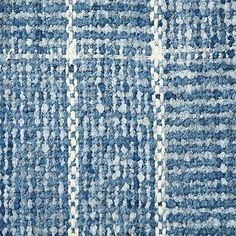 a blue rug with white stripes on it