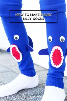 someone is wearing blue socks with red and white teeth on them, while the legs are made to look like a shark