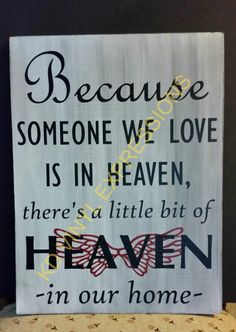 a sign that says because someone we love is in heaven there's a little bit of heaven in our home