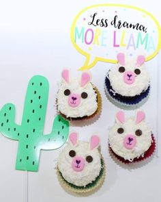 some cupcakes with bunny ears on them and a sign that says less drama more llama