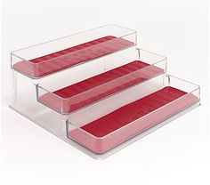 three tiered trays with red fabric on them