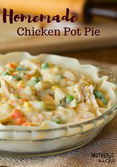 homemade chicken pot pie in a glass dish on a table with text overlay that reads homemade chicken pot pie