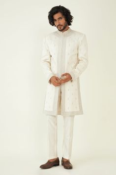 Off white sherwani highlighted with zari embroidered floral motifs. Comes with inner kurta and pant. - Aza Fashions Designer White Traditional Wear For Diwali, Designer White Sherwani For Eid, Designer Off White Sherwani With Chikankari Embroidery, Fitted Off White Sherwani With Zari Work, Designer White Fitted Traditional Wear, Designer Fitted White Traditional Wear, Designer White Sherwani With Dabka, Designer Wear White Sherwani With Dabka, Designer Off-white Sherwani With Chikankari Embroidery