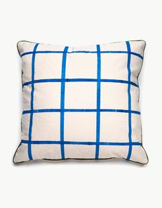 a blue and white pillow on a white background with a black line across the front