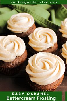 some cupcakes with frosting on them sitting next to a green napkin and cloth