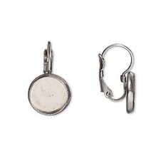 two pairs of silver earrings, one with a small round disc on the front and one with a smaller circle on the back