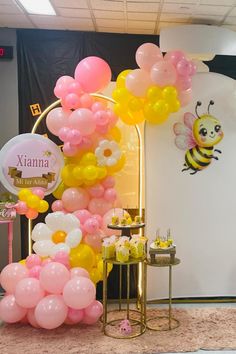 balloons and honeybees are on display in the lobby at xinna's new year's eve party