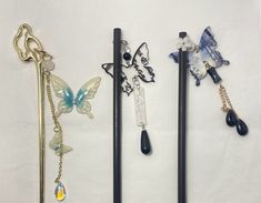 Step into a world of enchantment with our butterfly-themed hairpins, meticulously crafted from premium sandalwood and titanium steel for lasting durability and style. Each hairpin, measuring 18 cm, features a unique butterfly motif, symbolizing transformation and grace. The delicate details are complemented by various adornments like translucent beads and floral accents, creating a harmonious blend of nature and artistry. These hairpins are available in both sandalwood for a natural, earthy feel Enchanted Butterfly, Blank Hats, Unique Butterfly, Butterfly Motif, Delicate Details, Hair Sticks, Hat Hairstyles, Enchanted