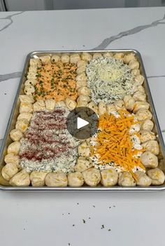 a metal tray filled with different types of food