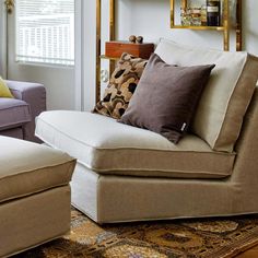 a living room filled with furniture and pillows