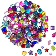 a bag filled with lots of colorful jewel stones next to a small bag of jewels