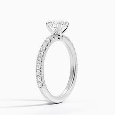 a diamond engagement ring on a white background