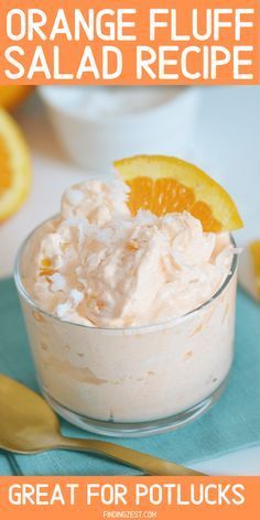 orange fluff salad recipe in a small glass bowl with an orange slice on top