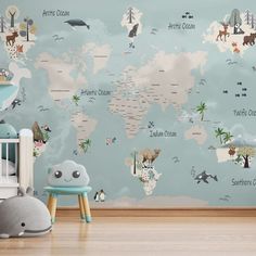 a child's room with a blue wall and world map on the wall