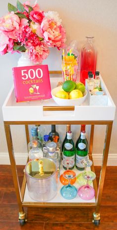 a bar cart filled with drinks and condiments