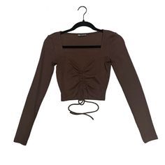 Never Worn! Adorable Cropped Long Sleeve Top From Zara With Adjustable Ruching In The Front In Brown. This Can Be Worn Super Casual Or On A Night Out! It Is Stretchy So It’s Very Comfortable. First True To Size Material: 95% Cotton 5% Elastane Brown Long Sleeve Top With Ruched Detail, Long Sleeve Brown Top With Ruched Detail, Fitted Brown Ruched Top, Ruched Tops For Day Out In Fall, Fitted Ruched Zara Tops, Ruched Tops For Fall Day Out, Casual Tops With Ruched Sides For Fall, Casual Fall Tops With Ruched Sides, Long Sleeve Cropped Top