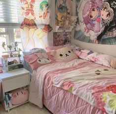 a bed room with a neatly made bed and anime posters on the wall above it