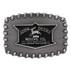 John Deere Stitched Buckle Antiqued silver finished squared oval Attitude buckle with whip stitched edging, radiating design and black John Deere logo. Standard 1.5 inch belt swivel. Dimensions: 3.72" X 2.6" Materials: Silver plate over a solid cast white metal alloy base. Paint. Montana Armor protective finish to prevent tarnish. Warranty: 1 year limited warranty on manufacturing defects when accompanied by a receipt. Western Black Belt Buckles With Silver Detail, Western Black Belt Buckles With Silver Buckle, Black Western Belt Buckles With Silver Buckle, Adjustable Black Belt For Rodeo, Black Adjustable Belt For Rodeo, Classic Black Rectangular Belt Buckles, Vintage Black Adjustable Belt Buckles, Vintage Adjustable Black Belt Buckles, Classic Black Concho Belt Buckles