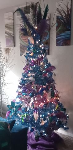 a brightly colored christmas tree in a living room