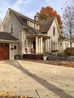 a house that is sitting in the fall leaves