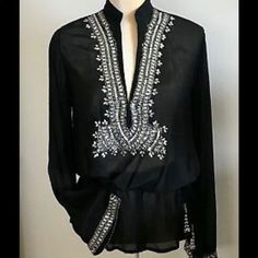 Monique Leshman Black Sheer Rhinestone Crystal Embellished Peplum Top With Embellished Bell Sleeves. Brand New With Tags, Never Worn. Small Tear In The String But It Is Barely Noticeable. Please See The Last Picture For Details. Formal Black Embellished Blouse, Elegant V-neck Blouse With Mirror Work, Elegant Embroidered Blouse For Night Out, Black Elegant Embellished Blouse, Elegant Embellished Summer Blouse, Elegant Rhinestone Blouse For Night Out, Black Tops With Mirror Work, Elegant Mirror Work Tops For Evening, Silk Tunic Top