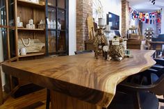 a large wooden table sitting in the middle of a room