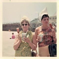 two women standing next to each other holding coffee cups and ice cream cones in their hands