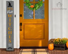 an orange front door with a welcome sign next to it