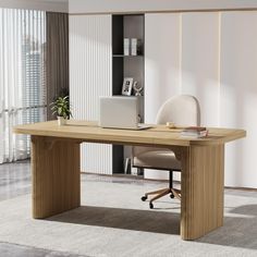 an office desk with a laptop on it