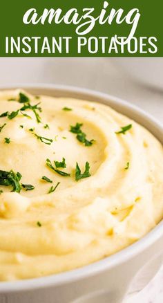 a white bowl filled with mashed potatoes topped with parsley